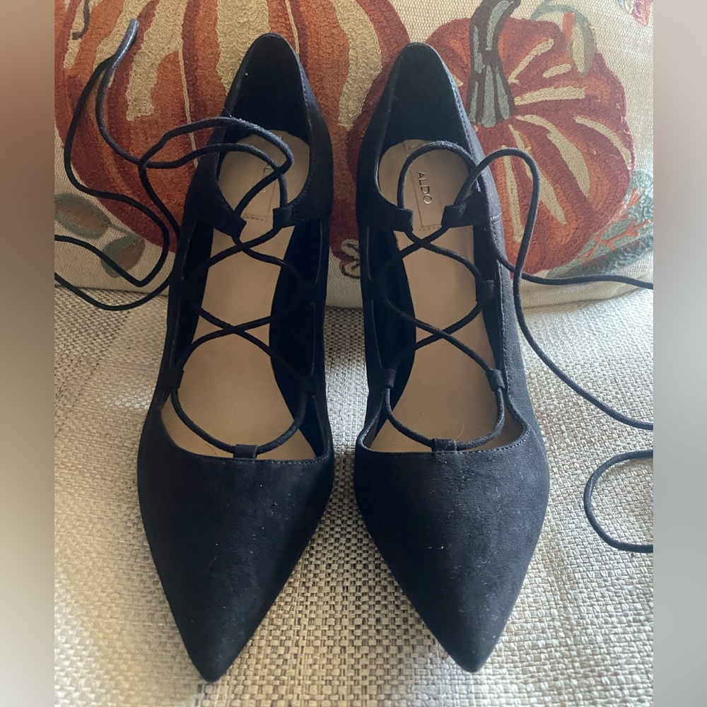 Also faux suede heels with straps never worn runs small size 8 fits like a 7
